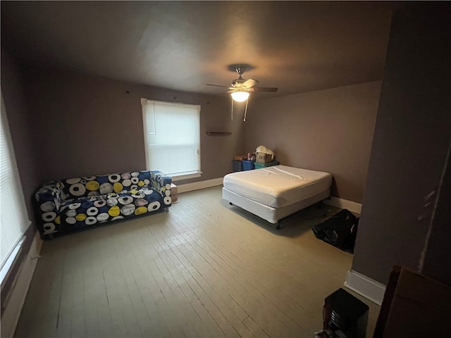 bedroom featuring ceiling fan and light hardwood / wood-style floors