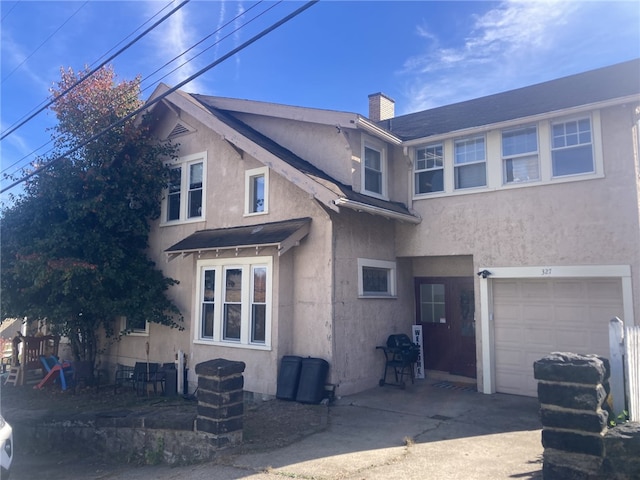 back of house featuring a garage