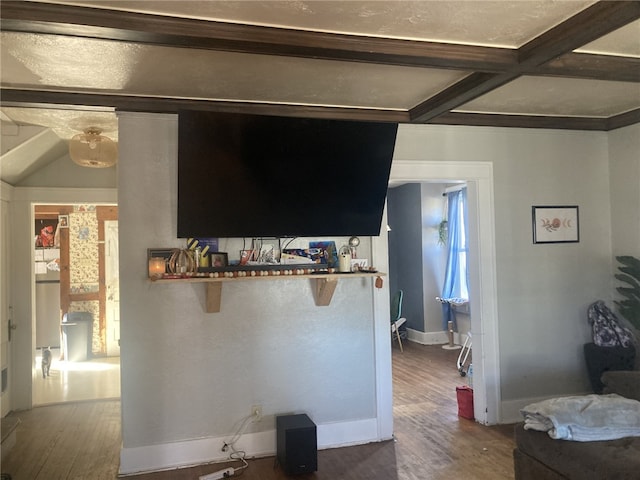 interior space featuring beamed ceiling, hardwood / wood-style floors, and coffered ceiling