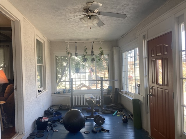 sunroom / solarium with ceiling fan