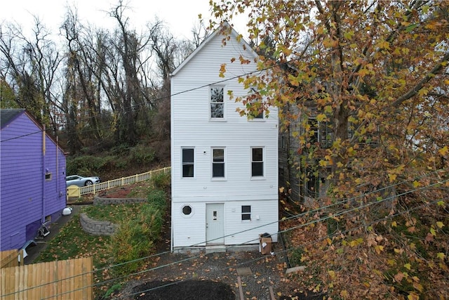 view of property exterior featuring fence