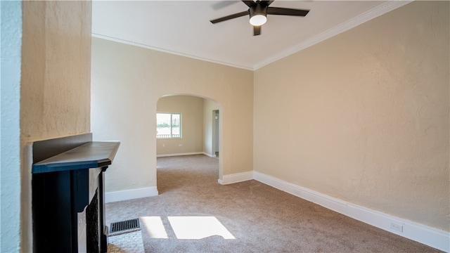 unfurnished living room with ceiling fan, light colored carpet, and ornamental molding