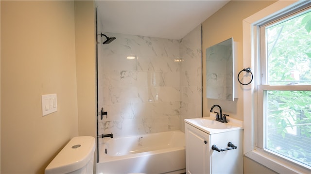 full bathroom with vanity, toilet, and tiled shower / bath combo