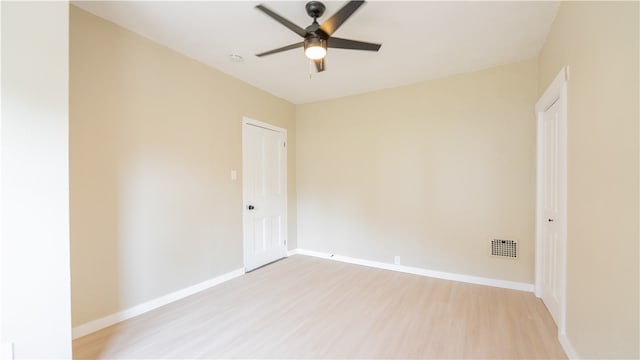 unfurnished room with light hardwood / wood-style flooring and ceiling fan