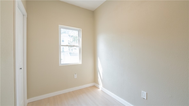 spare room with light hardwood / wood-style floors