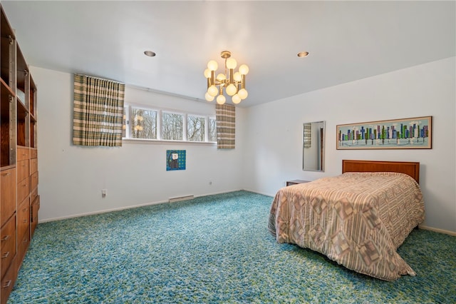 bedroom featuring carpet flooring and a chandelier