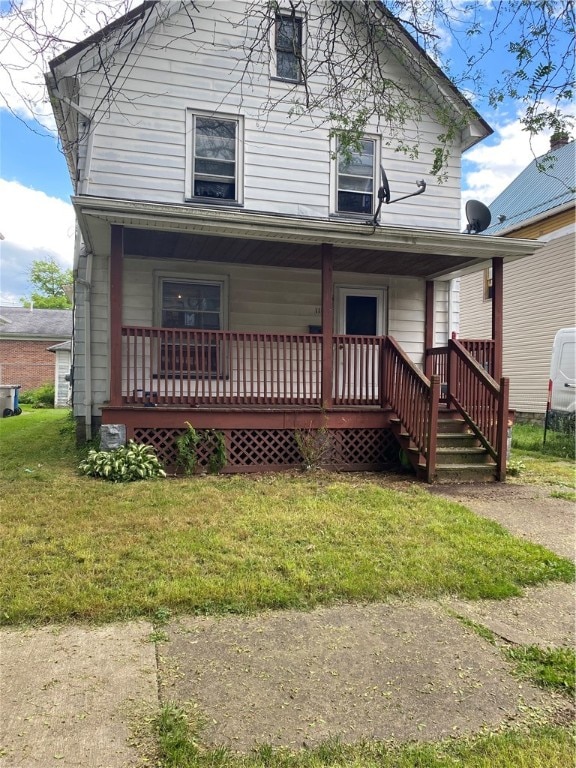 view of front facade featuring a front yard and a porch