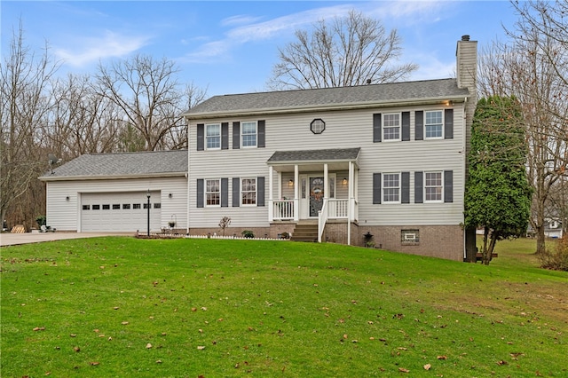 colonial home with a front yard, a porch, and a garage