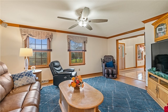 living room with wood-type flooring, ceiling fan, and crown molding