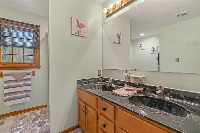 bathroom with vanity and tile patterned floors