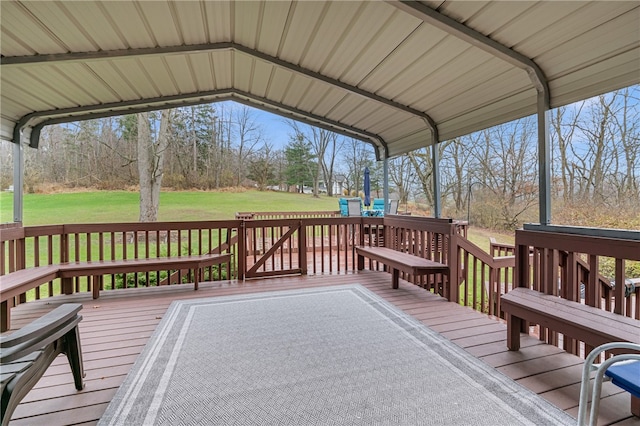 wooden terrace with a yard