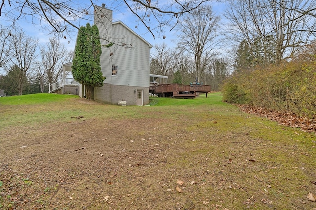 view of yard with a wooden deck