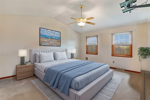 carpeted bedroom featuring ceiling fan and lofted ceiling