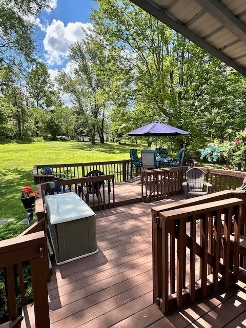 wooden deck with a lawn