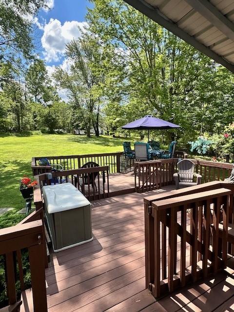 104 Caromar Dr, Adams Twp, PA 16046 - deck with outdoor dining space, a lawn, and view of wooded area