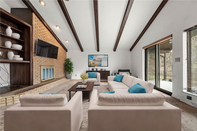 carpeted living room with a fireplace, beamed ceiling, and high vaulted ceiling