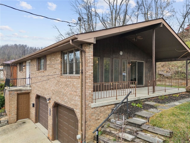 view of property exterior featuring covered porch and a garage