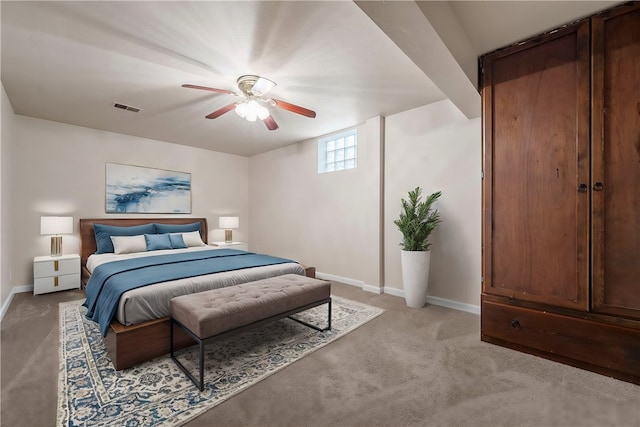 bedroom with ceiling fan and light carpet