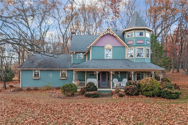 victorian-style house featuring a porch