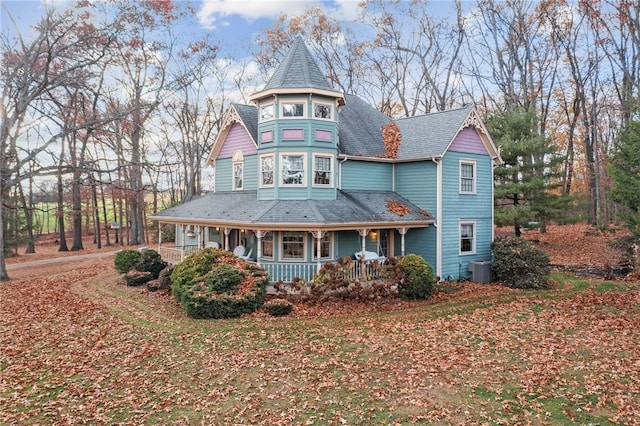 view of front of home with central air condition unit and covered porch