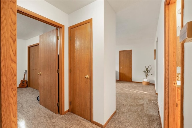 hallway with light carpet