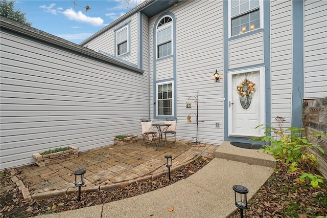 entrance to property featuring a patio area