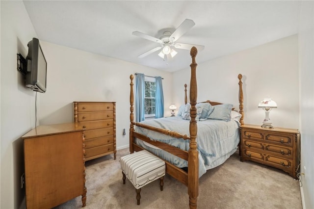 bedroom with light colored carpet and ceiling fan