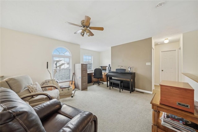 living room featuring light carpet and ceiling fan