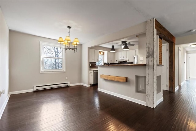 interior space with ceiling fan with notable chandelier, a baseboard radiator, a wealth of natural light, and dark wood-type flooring