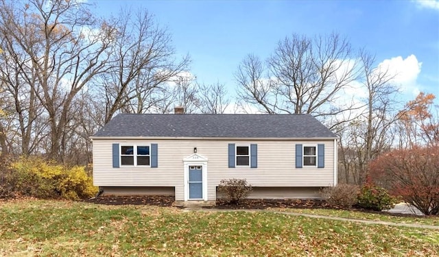 bi-level home with a front yard