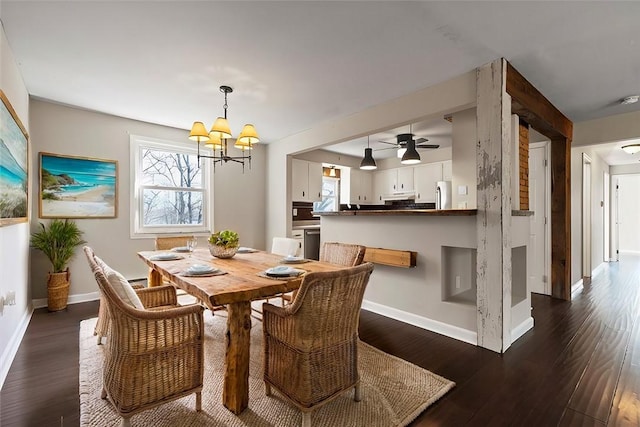 dining area with ceiling fan with notable chandelier and dark wood-type flooring