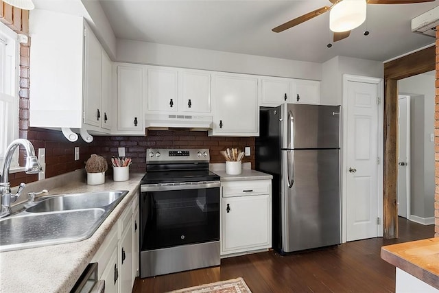 kitchen with white cabinets, appliances with stainless steel finishes, tasteful backsplash, and sink