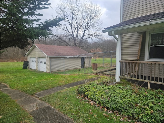 view of yard featuring an outbuilding and a garage