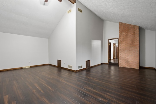 bonus room featuring a textured ceiling, ceiling fan, dark wood-type flooring, and vaulted ceiling