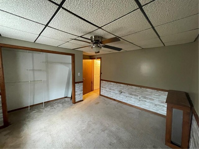 306 E Main St, Ligonier Boro, PA 15658 - unfurnished bedroom featuring baseboards, a drop ceiling, carpet floors, a closet, and ceiling fan