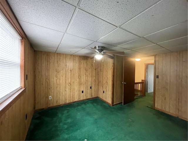 306 E Main St, Ligonier Boro, PA 15658 - spare room featuring wood walls, ceiling fan, carpet floors, a drop ceiling, and baseboards