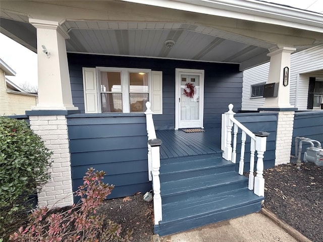 property entrance featuring covered porch