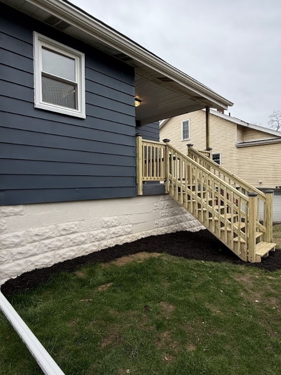 wooden terrace with a lawn