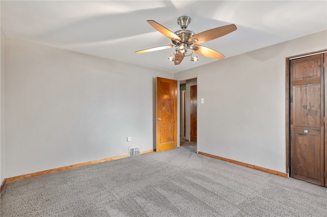 empty room with carpet floors and ceiling fan