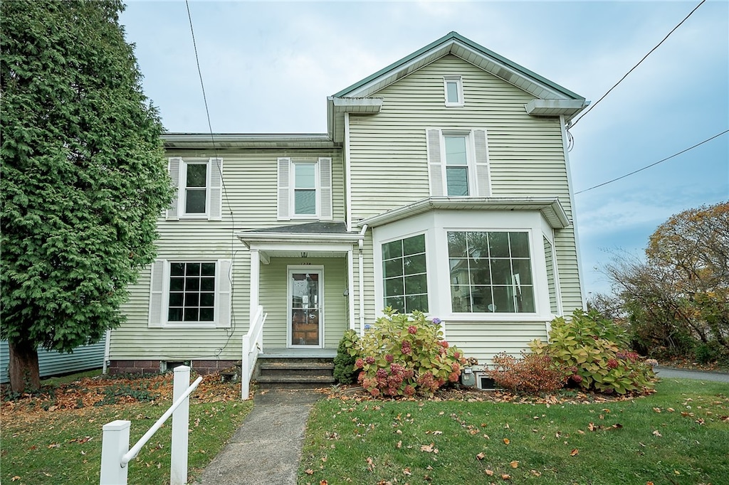 view of front property with a front lawn