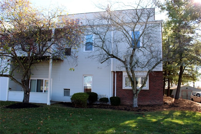 view of side of property with a lawn