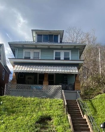 view of front of property featuring covered porch