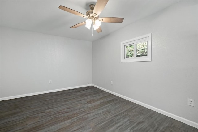 spare room featuring ceiling fan and dark hardwood / wood-style flooring