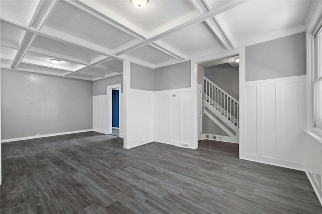 interior space featuring beamed ceiling, dark wood-type flooring, and coffered ceiling