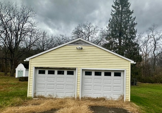 garage with a yard