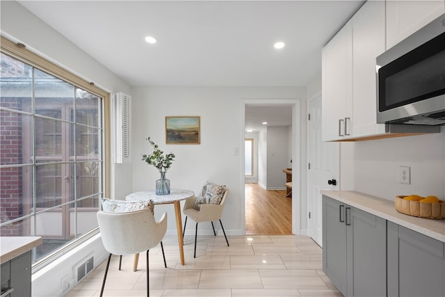 dining area with light hardwood / wood-style floors