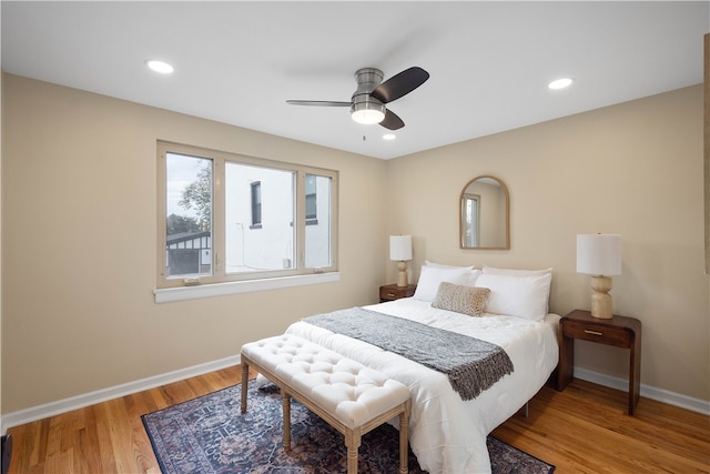 bedroom featuring hardwood / wood-style floors and ceiling fan