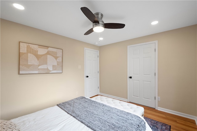 bedroom featuring hardwood / wood-style flooring and ceiling fan