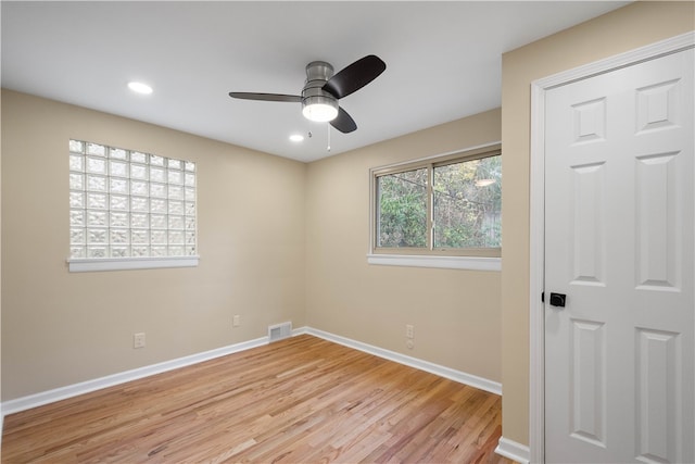 empty room featuring ceiling fan and light wood-type flooring