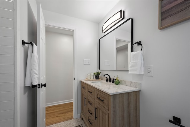 bathroom with vanity and hardwood / wood-style flooring